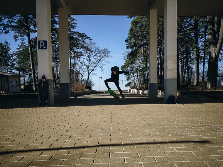 boy practicing skateboard tricks femlens